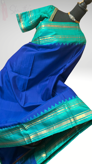Finest weave of the softest drape our blue on sea green Gadwal silk saree with embroidered stitched blouse