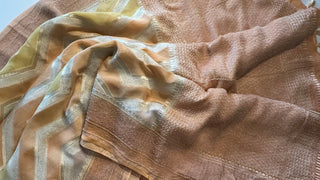 Readymade blouse with zari cuffs complements the soft silk saree effortlessly.