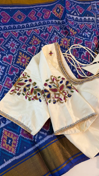 Pure indigo blue patola silk saree with white silk finish pallu and elegant border