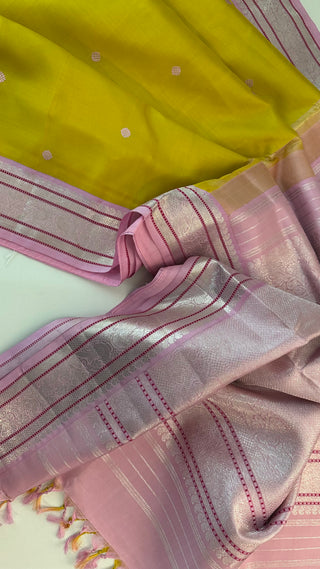 Shop pastel Kanchipuram silk saree with silver zari detailing and hand-embroidered blouse, ideal for weddings and festivals.