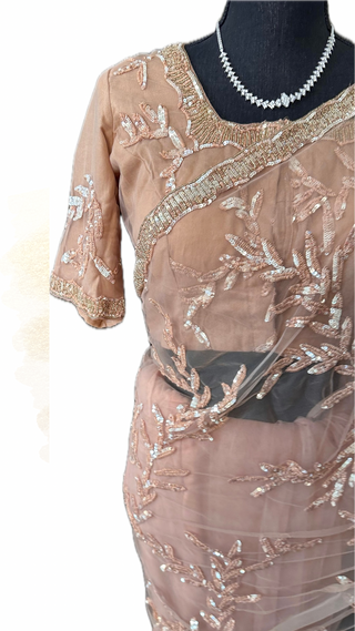 Lightweight peach silk saree with floral sequin embroidery border
