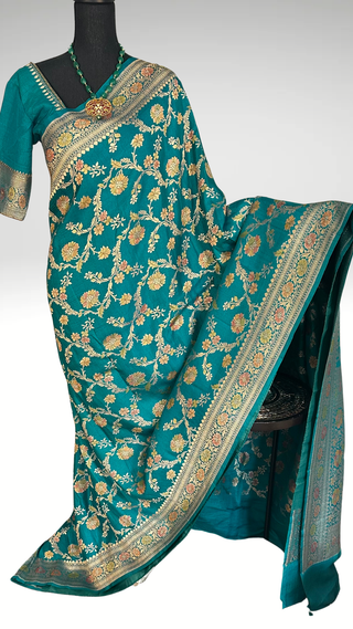 Elegant lotus pink Banarasi Tussar Georgette Katan silk saree with silver zari border and prestitched blouse, ideal for Indian weddings and festive wear.