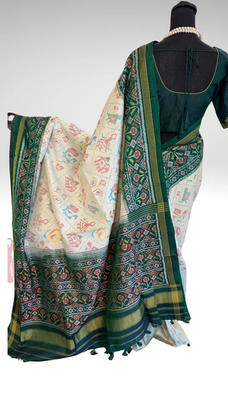 Luxury green Patan Patola saree made from pure mulberry silk with handwoven double thread design