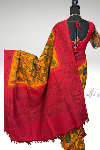 Elegant green kanchi pattu saree with hand painted kalamkari motifs, traditional zari border and prestitched blouse.
