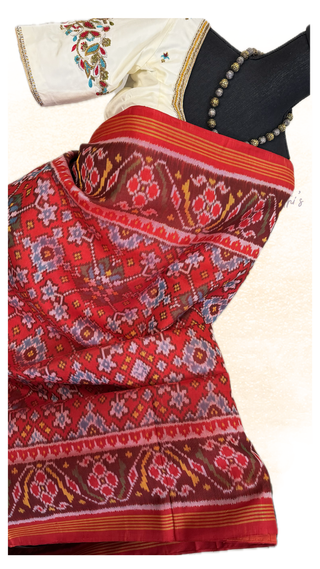Red Patan Patola silk saree paired with hand embroidered pre-stitched silk blouse