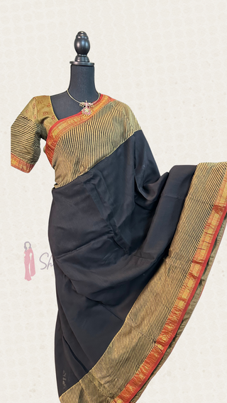 Black Maheshwari silk cotton saree featuring red triangle motifs on the pallu with rich golden zari border, perfect for evening wear.