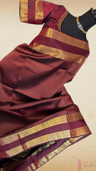 Easy-to-drape modern Kanchipuram silk saree in deep burgundy with pure zari and hand-embroidered stitched blouse.