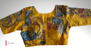 Readymade Kalamkari blouse in mustard yellow, lined and padded with intricate embroidery.