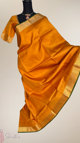 Elegant mustard yellow Kanjivaram handloom silk saree with rich zari border, fine drape, and ready-to-wear blouse, perfect for weddings and traditional ceremonies.