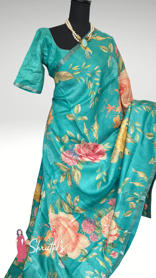 Artistic floral print silk saree in bright turquoise shade