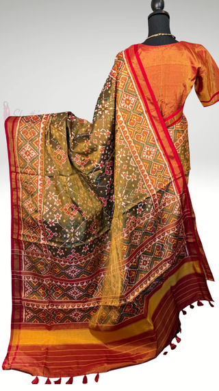 Traditional double ikat Patola silk saree in olive green shade with premium weave, silk finish pallu, and ready-to-wear stitched blouse for convenience.