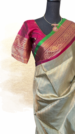 Traditional Gadwal pure silk saree featuring intricate gold zari weaving