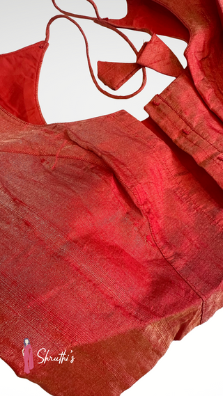 Well-stitched red tissue blouse lined and padded for comfort