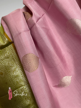 Pastel pink Kanjivaram silk saree with contrast green border and zari design online USA.