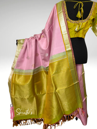 Pastel pink wedding Kanjivaram silk saree with green border and embroidered blouse USA online.