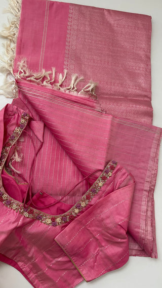 Pure handwoven pastel pink Kanjivaram silk saree with silver zari detailing, borderless design, and prestitched blouse for an elegant drape.