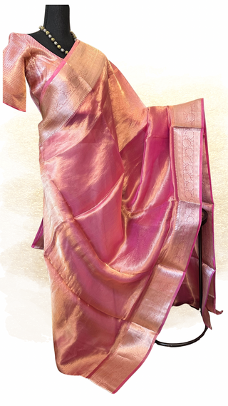 Elegant pastel pink pure tissue Banarasi silk saree handwoven with fine silver zari detailing and a prestitched brocade blouse.