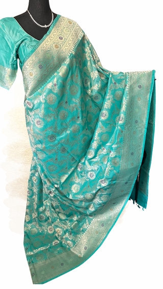 Pastel turquoise Katan silk saree with silver zari border