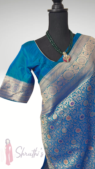 Peacock blue pure Katan Banarasi silk saree with silver and gold zari and stitched blouse