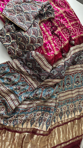 Pink Bandhini saree in pure silk with contrast Ajrakh printed pallu and blouse.