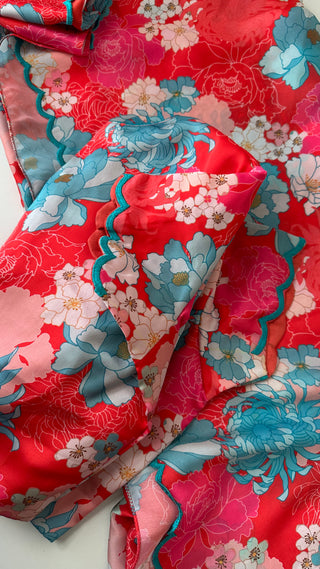 Pink satin silk printed saree with hand-embroidered scallop edging and matching prestitched blouse.