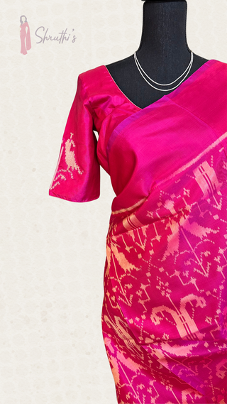 Elegant pink Patola silk saree with traditional handwoven motifs and matching stitched blouse, perfect for bridal and festive wear.