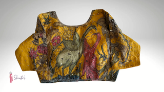 Yellow cotton blouse with Kalamkari painting of animals and floral motifs, embroidered details.