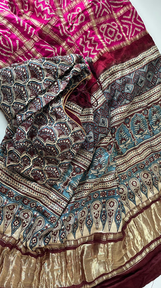 Pure silk pink Bandhani saree with rich Ajrakh detailing, handcrafted for elegance.