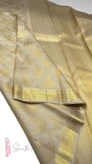 Gold handloom Kanjivaram silk saree with pure zari borders and embroidered blouse ideal for pooja and bridal occasions