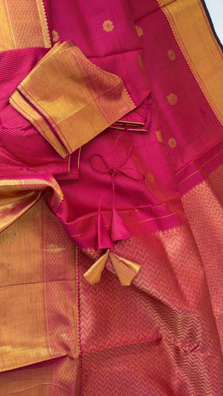 Dark pink handloom kanjivaram silk saree woven with pure zari peacock motifs and elegant border