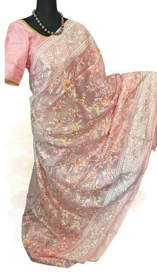 Elegant pure Kota saree in pastel pink featuring intricate woven embroidery and ready blouse.