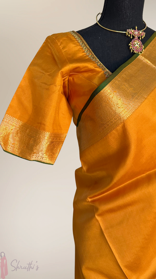 Handwoven mustard yellow Kanjivaram silk saree featuring heritage zari weaving and stitched ready-to-wear blouse, ideal for Indian weddings and bridal events.