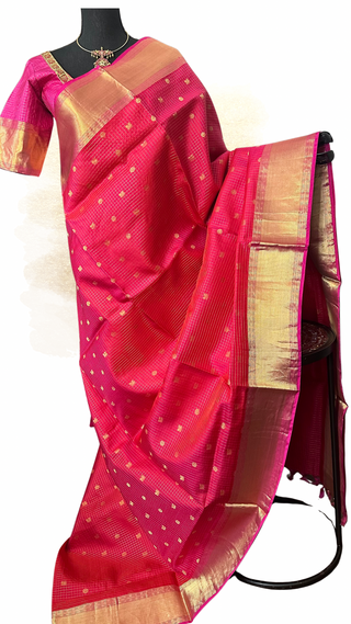 Pure Kanjivaram pinkish red handloom silk saree with rich zari work and ready-made blouse, perfect for Muhurtam weddings.