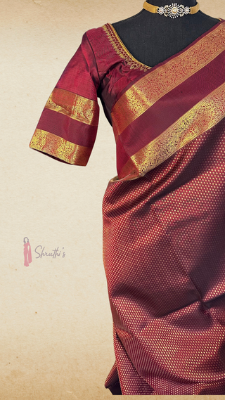 Pure handloom Kanjivaram silk saree in dark burgundy with rich gold zari work and elegant prestitched embroidered blouse.