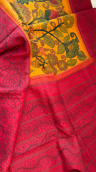 Handcrafted pen kalamkari Kanchipuram silk saree featuring detailed border, rich pallu and gold zari weaving.