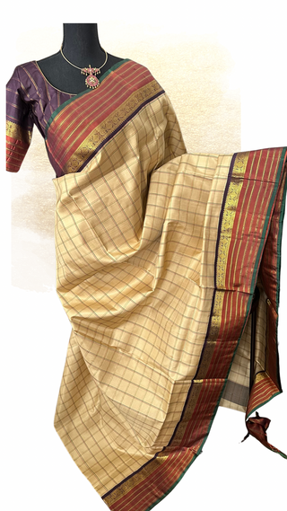 Pure Kanjivaram Ven Pattu checks silk saree with zari border and stitched blouse, perfect for Indian weddings.