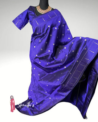 Traditional Paithani silk saree with silver zari work and single muniya border, paired with matching blouse