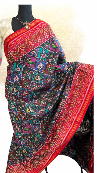 Authentic handwoven Patan Patola silk saree in red with intricate animal motifs and double-sided fine weave