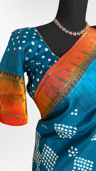 Blue Green Bandhani Paithani saree crafted from pure silk with intricate handdone design, heavy zari pallu, and stitched blouse.