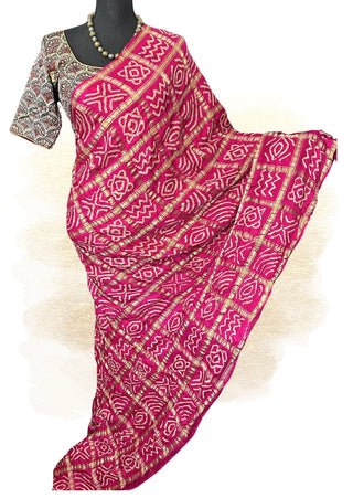 Handcrafted Bandhani silk saree in pink shade featuring Ajrakh Gajji silk pallu and blouse.
