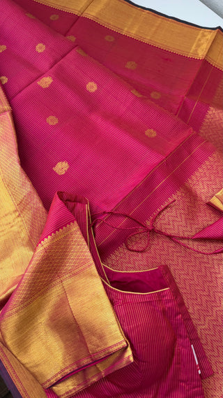 Dark pink kanjivaram silk saree with pure zari weaving paired with prestitched blouse size 36–42