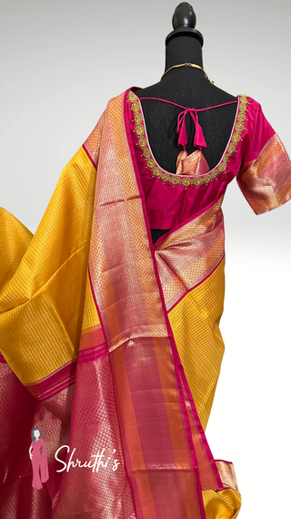 Traditional bridal silk saree in yellow with intricate silver zari work.