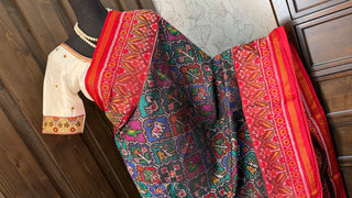 Red patan patola silk saree paired with stitched padded silk blouse