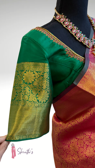 Traditional Kanchipuram silk saree with floral zari motifs and contrast green blouse