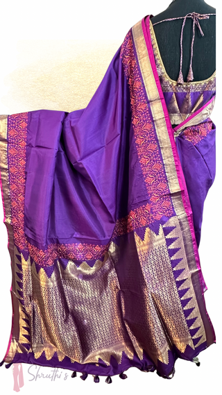 Royal purple silk saree adorned with gold floral embroidery and matching embroidered blouse for an elegant drape