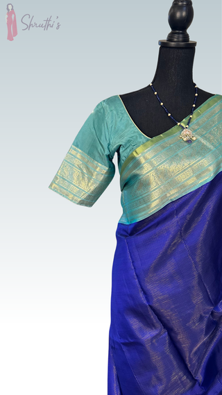 Royal blue Kanchipuram silk saree with silver zari border and prestitched blouse, perfect for weddings, Indian bridal wear, and online shopping USA.