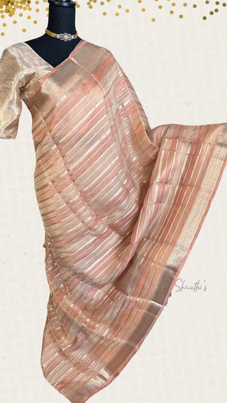 Elegant pink Banaras tissue silk saree with pure zari and prestitched blouse, handcrafted for a graceful drape.