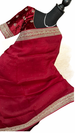 Dark red organza partywear saree with velvet blouse