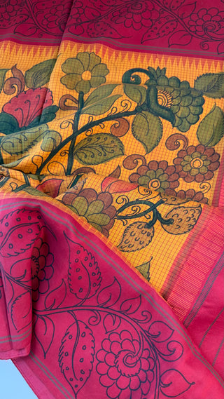 Green handwoven kanchi silk saree with intricate pen kalamkari art, pure zari border and stitched blouse included.