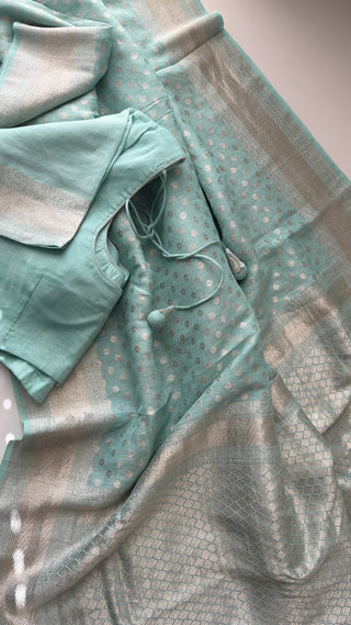 Breathable pastel cyan linen saree with silver zari perfect for summer events